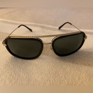 Versace women sunglasses black with light gold frame.